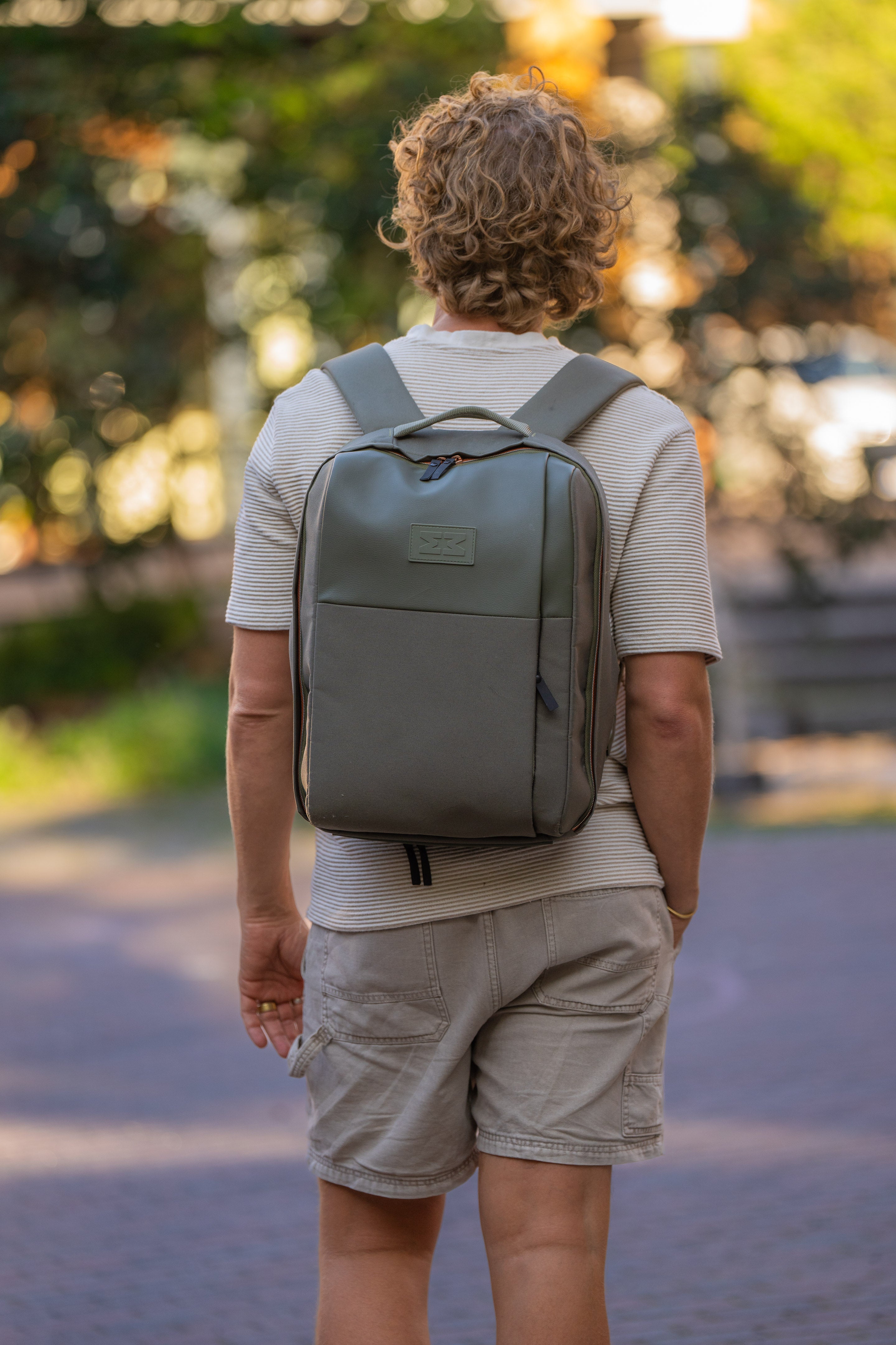 MiniMeis HERO Backpack | Diaper Backpack | Olive | Man with Backpack Facing in Front | SavvyMamaSG