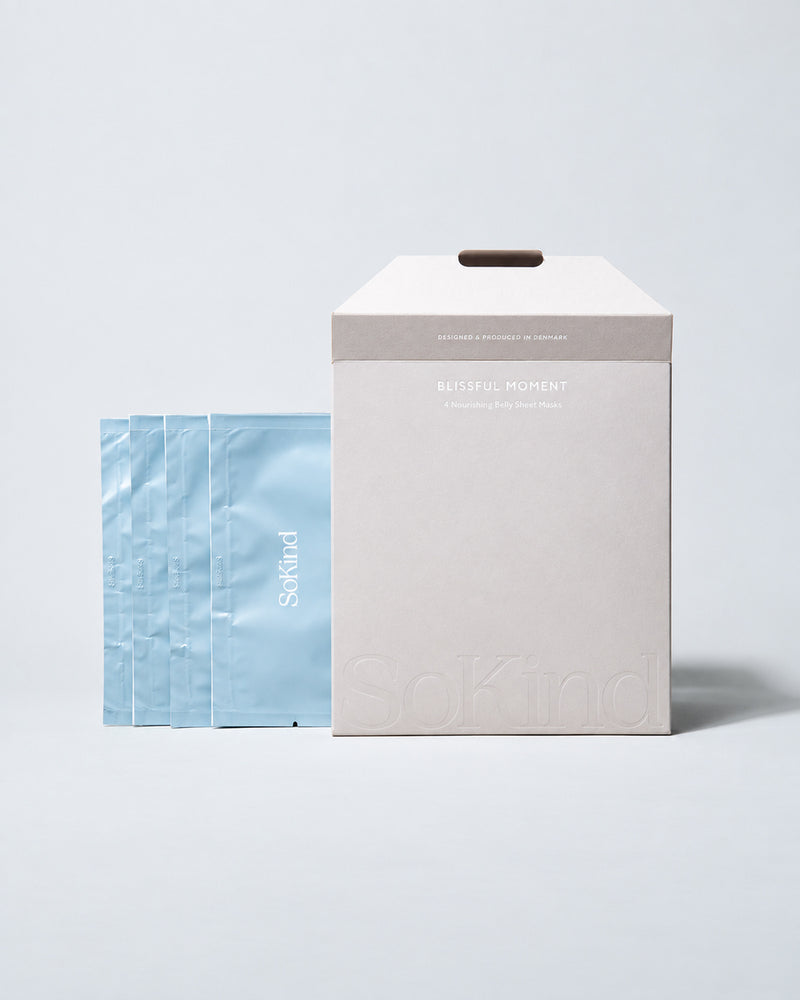 sokind-blissful-moment-belly-sheet-mask-4-pack-box.jpg SoKind Blissful Moment nourishing belly sheet mask box beside four blue sachets