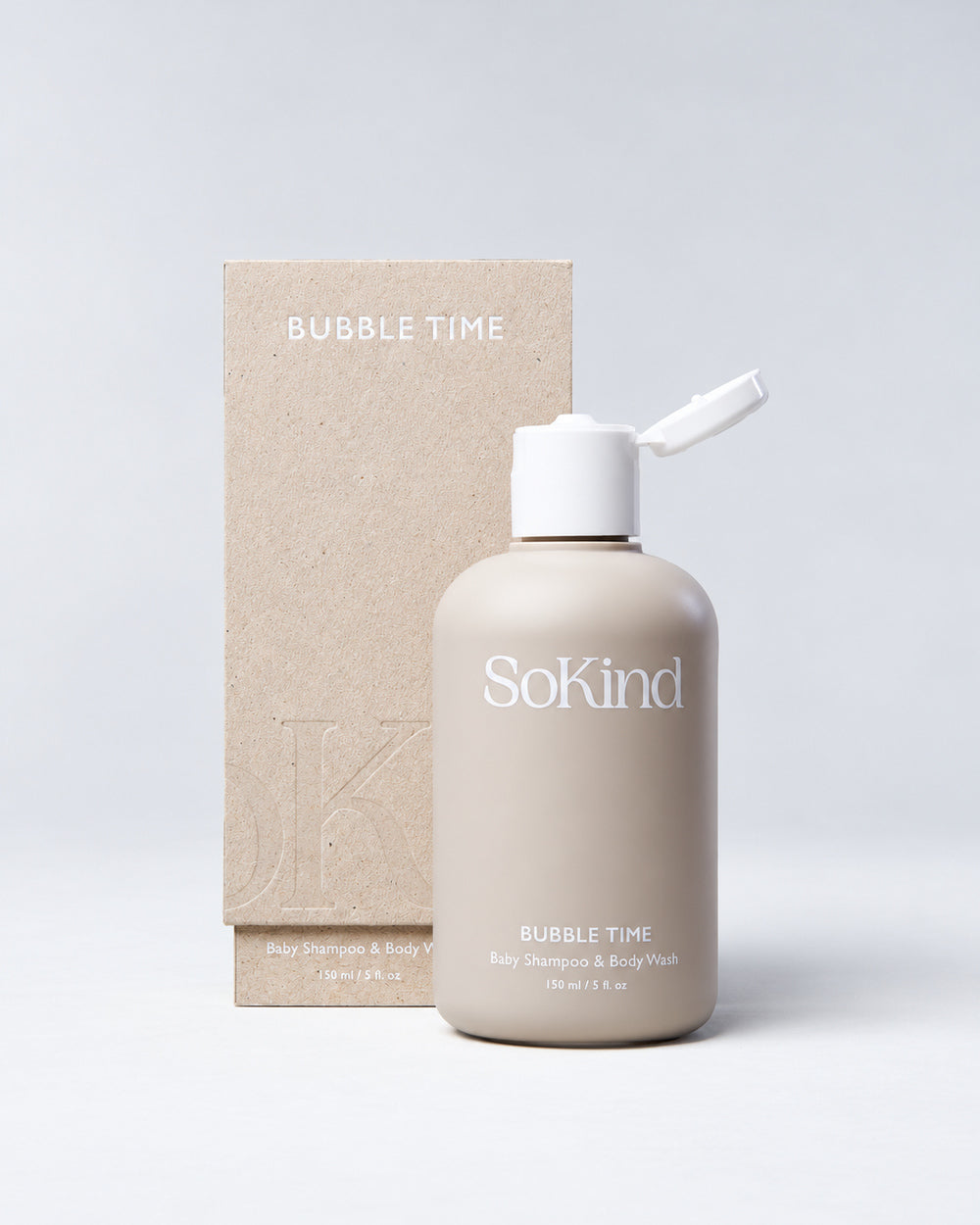 SoKind Bubble Time baby shampoo and body wash bottle with water droplets and floating soap bubbles