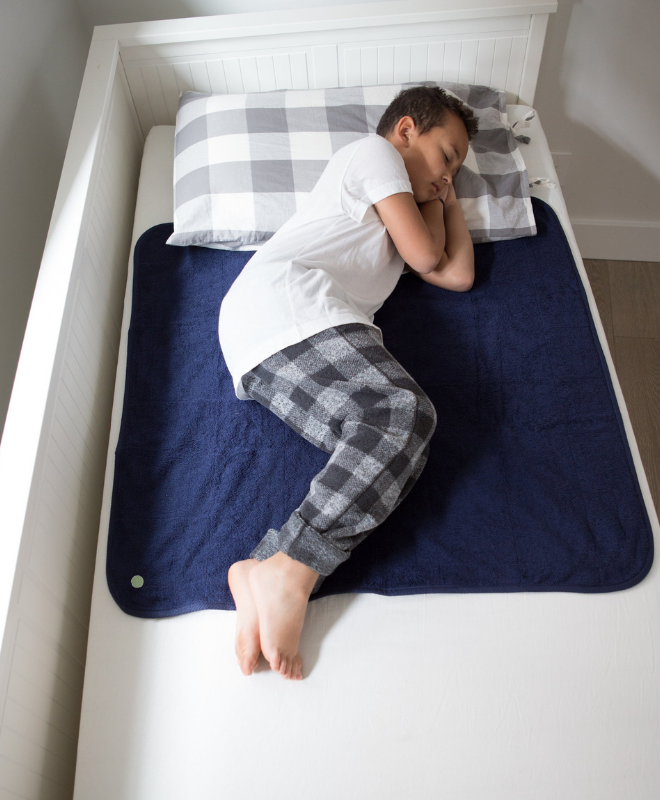 Peapod Mats | Boy on Single Bed | Waterproof Mat | Mattress Protector  | Navy Blue | Savvy Mama